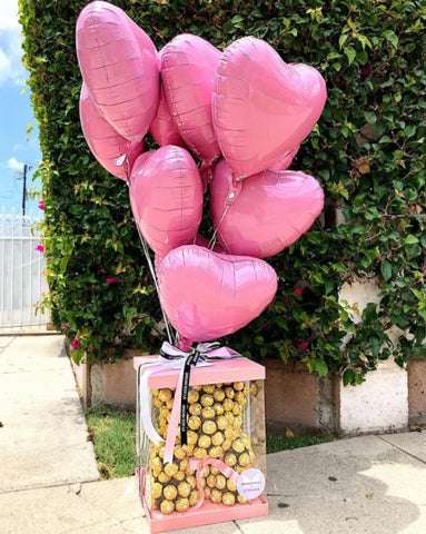 Pink heart-shaped balloons attached to our signature Golden Mishka arrangement (not included in the order, have to make a separate one)