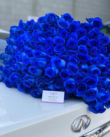 Our Blue Rose Bouquet is a hand-crafted bouquet with a simple ribbon around it and Royal Blue long stem roses.   The one in the picture has approximately 125 roses. 