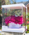 White Amelia Box with hot pink peonies inside, decorated with a butterfly